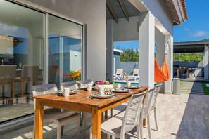 Dine al fresco in style with this beautiful outdoor dining area, perfect for enjoying meals with a view.