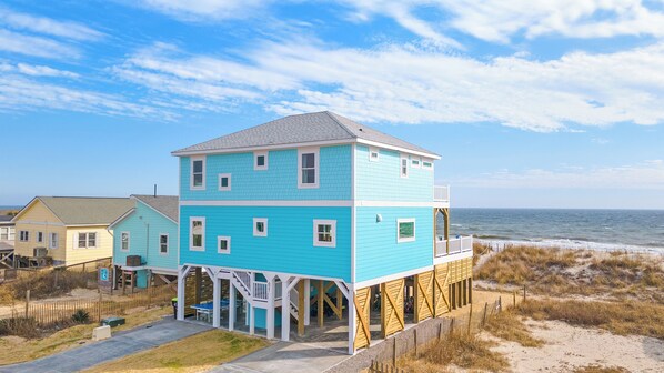 Double decks overlooking direct beach access and ocean behind.