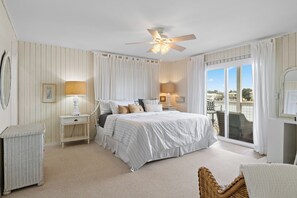 Wake up to paradise! Cozy linens, coastal charm, and stunning water views await.