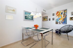 Modern dining area off the lounge with seating for four guests