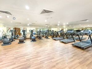 Fitness Center: Energize your stay with top-notch gym equipment and inspiring natural light!