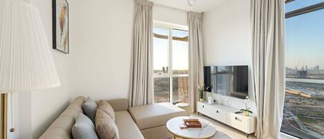 Living Room: Bright space with stunning views, plush seating, and stylish decor for your leisure time!