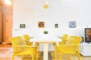 Gather around the dining table for a cozy meal or morning coffee. Perfect for families or friends! Book your stay now and enjoy!