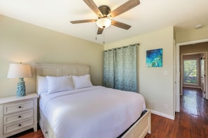 Queen Bed in the primary bedroom with ensuite half bath