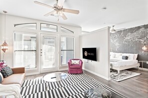 Open-concept space with living and bedroom.