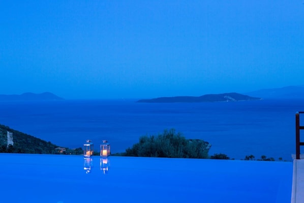 Pool with sea view in night