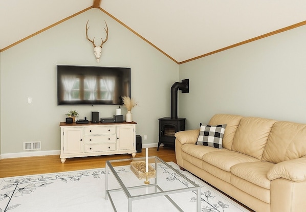 Living room with 75” Samsung smart TV with Bose speaker system- first floor