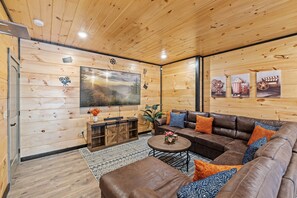 Game room includes arcade, pool table, foosball, and movie area.