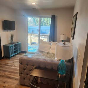 Lots of light coming through the sliding glass door leading to the hot tub