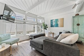 Large sectional couch in the living area. Couch is large enough to sleep one person. 