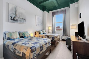 The second bed has two full beds, a dresser, tv and a nice view to the William A Irvin Museum ship.