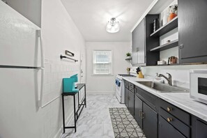 Kitchen: Cook with ease in this functional kitchen featuring updated appliances and essentials.