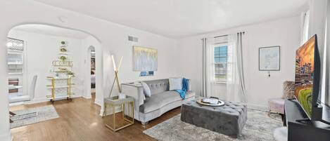 Living Room: Kick back and relax in a modern, comfortable living space with a plush sectional.