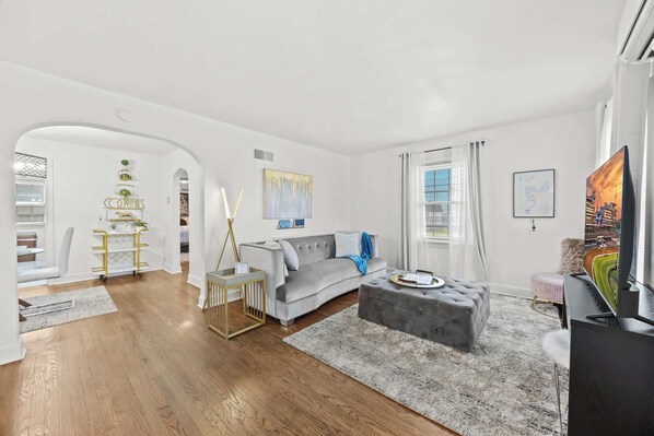 Living Room: Kick back and relax in a modern, comfortable living space with a plush sectional.