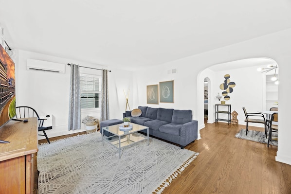 Living Room: Relax in this modern, open-concept living area with a plush sectional.