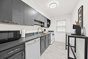 Kitchen: Bright and functional, this kitchen makes cooking a breeze during your stay