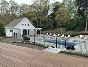 Pool house featuring a bar, fridge, TV, 1 bedroom, 1 bathroom and a loft!