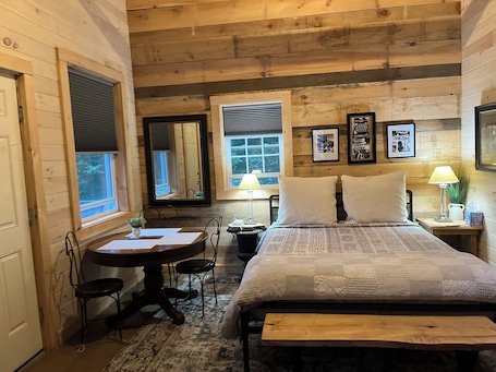 Comfy Queen bed in Kilimanjaro cabin. Upstairs loft has two twins.