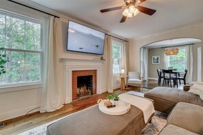 The living room features a 65" Roku tv. The fireplace is not functional. 