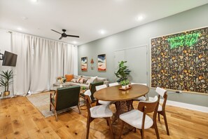 Well appointed kitchen with 4 bar stools, 6 person dining table, and super comfortable pull out sofa bed.