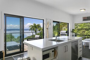 Full Kitchen with a dishwasher, and lake views