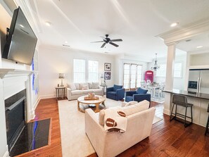 Gas log fireplace and 80" flat-screen smart TV make for excellent relaxation