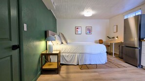 Drift off to sleep in this cozy queen bed, with nightstands and warm bedside lamps to create a relaxing ambiance.