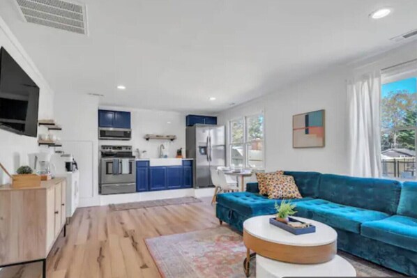 Enter into our open floor plan living and dining area with a fully stocked kitchen with new stainless steel appliances