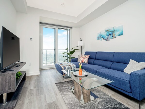 Modern Living Room with Smart TV and Direct Balcony Access 