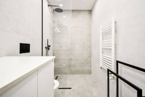 Freshen up in this sleek, modern bathroom – where comfort meets elegance. 🚿 Book Your Stay Now!
