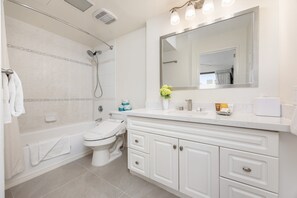 Full bathroom with tub and shower combination