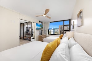 The bedroom has a flatscreen TV, a queen-size bed, and a full-size bed perfect for your relaxation!