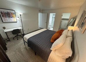 Ensuite Bedroom w/ King Bed with Workspace w/ Chair