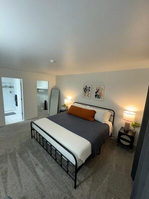 Ensuite Bedroom w/ King Bed with Workspace w/ Chair