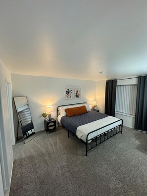 Ensuite Bedroom w/ King Bed with Workspace w/ Chair