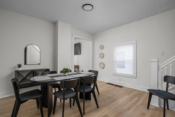Dining Room: Gather around the sleek table and enjoy delightful meals in a bright, stylish setting!