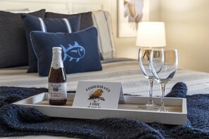 The serene queen bedroom boasts an ensuite bath & TV