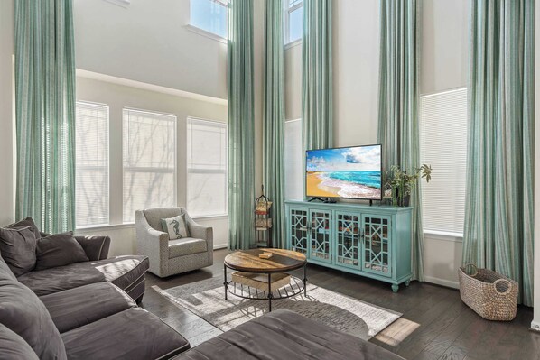Curl up in the elegant living room & stream your favorites on the smart TV