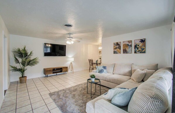 This spacious living room offers you and your companions plenty of space to sit back, stretch out, relax, and enjoy your favorite TV shows and movies!
