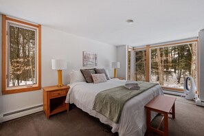 Restful bedroom with mountain views.