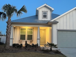 Relax on our front porch, watching the night sky glow from the sunset. 