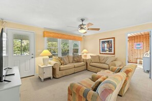 This comfy living room offers space for everyone to gather!
