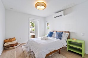 Downstairs apartment with a full size bed.