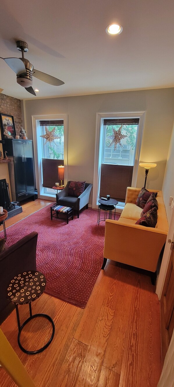 Airy, comfy parlor level living room enjoys 12' ceilings &  8' windows. + WBF! 