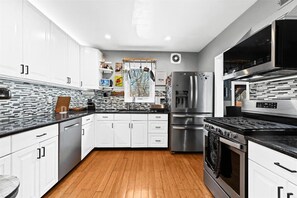 Fully equipped kitchen with a gas stove and premium cooking essentials
