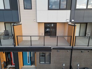 Step outside to a spacious private patio with a Skyline view of the City