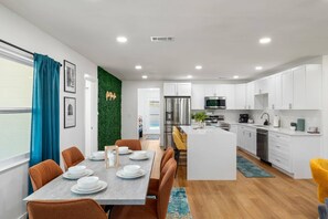 Spacious open-concept living with a fully equipped kitchen, cozy seating, and room for everyone to feel at home