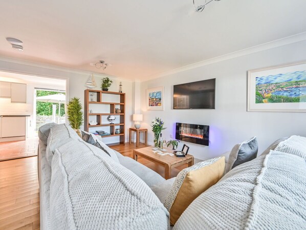 Furniture, Interior Design, Couch, Flooring, Floor, Wood, Living Room, Television, Ceiling, Room