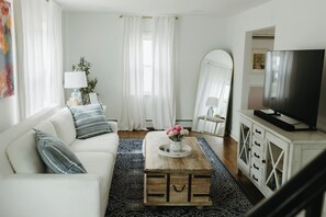 Enter the front door right into the plush living room area