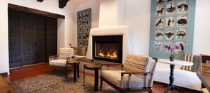 Cozy, artistic fireplace corner.